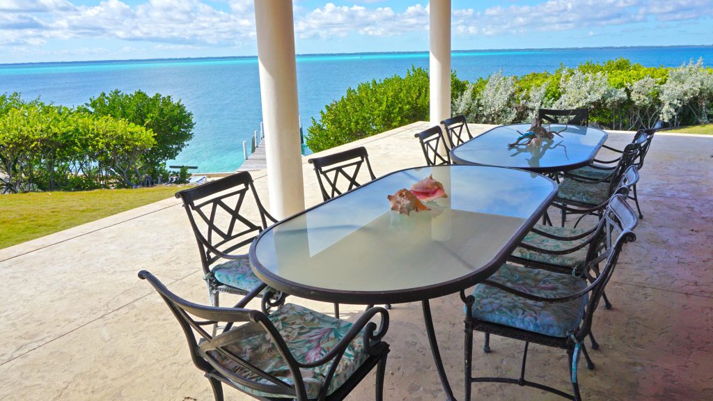 Main Villa - Outdoor dining area overlooking the sea of Abaco